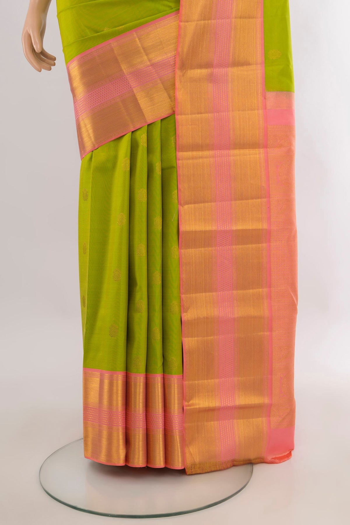 Pleats and pallu of Pure Silk Parrot Green Kanjivaram Saree with Zari Butta on the body and Zari Border. 