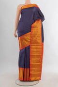 Pure Silk Navy Blue Kanjivaram Saree with Zari Butta on the body and Zari Border.  displayed on a mannequin