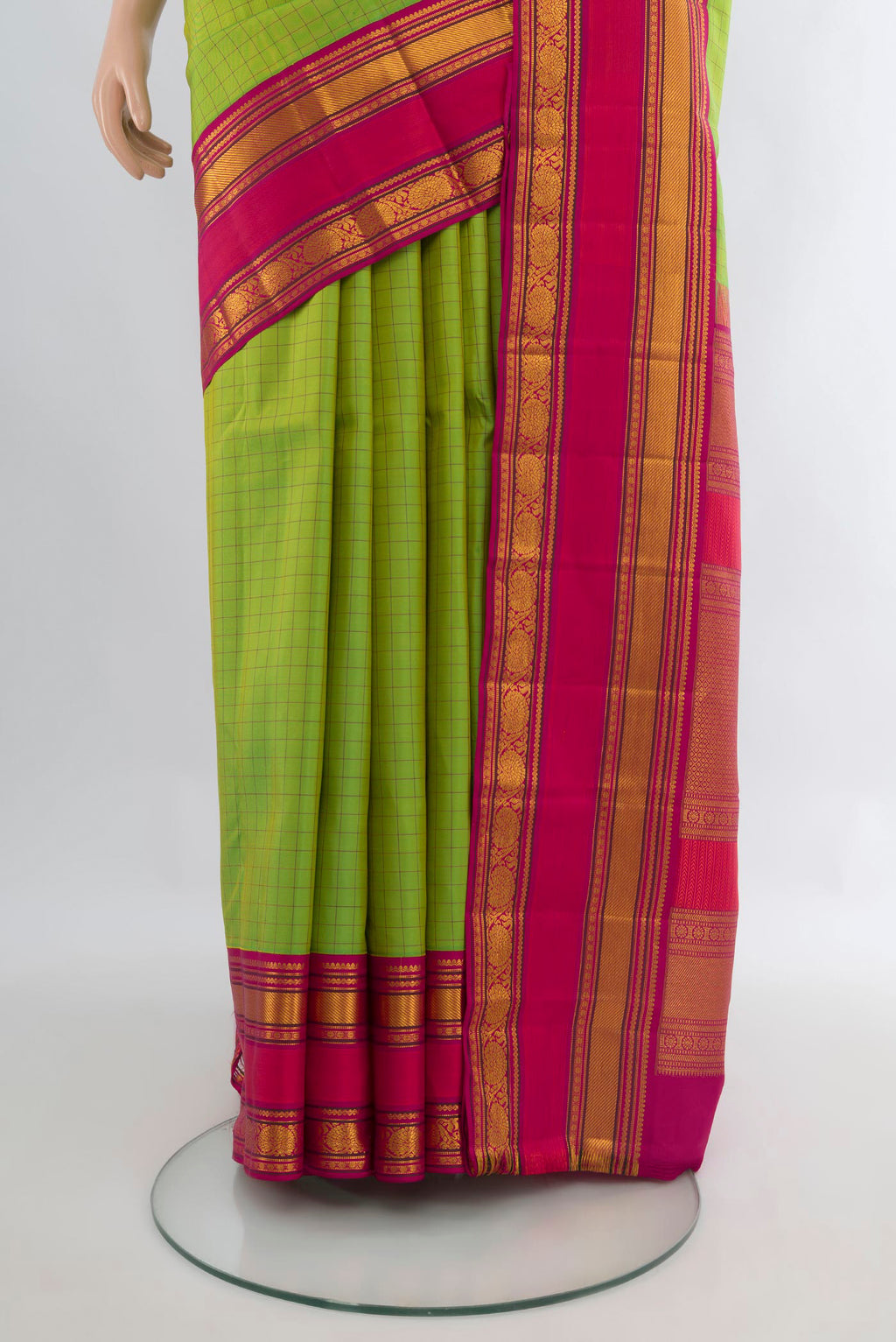 Pleats and pallu of Pure Silk Parrot Green Kanchipuram Saree with Checked design on the body and Zari Border. 
