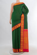 Pure Silk Bottle Green Kanchipuram Saree with Checked design on the body and Zari Border.  displayed on a mannequin