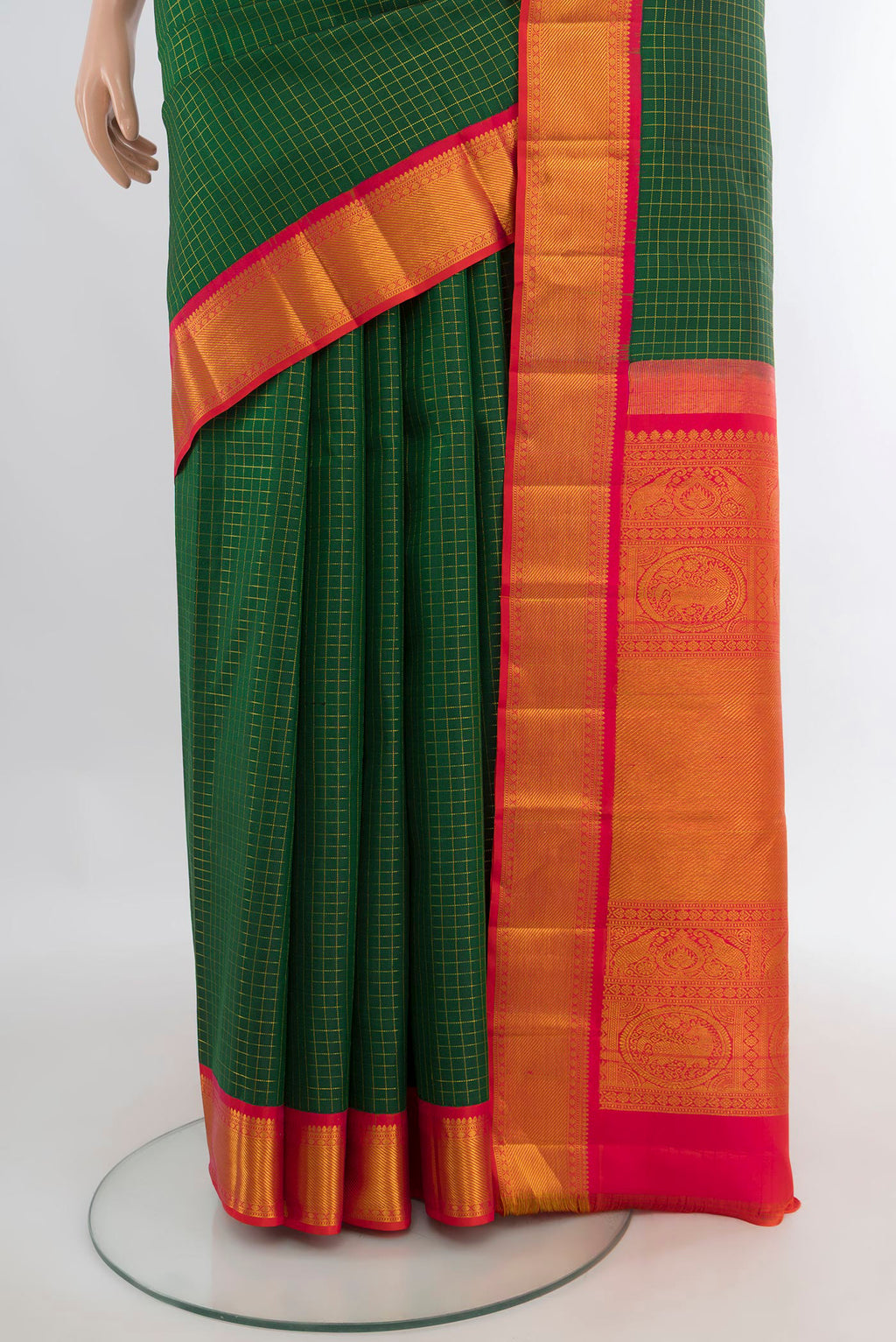 Pleats and pallu of Pure Silk Bottle Green Kanchipuram Saree with Checked design on the body and Zari Border. 