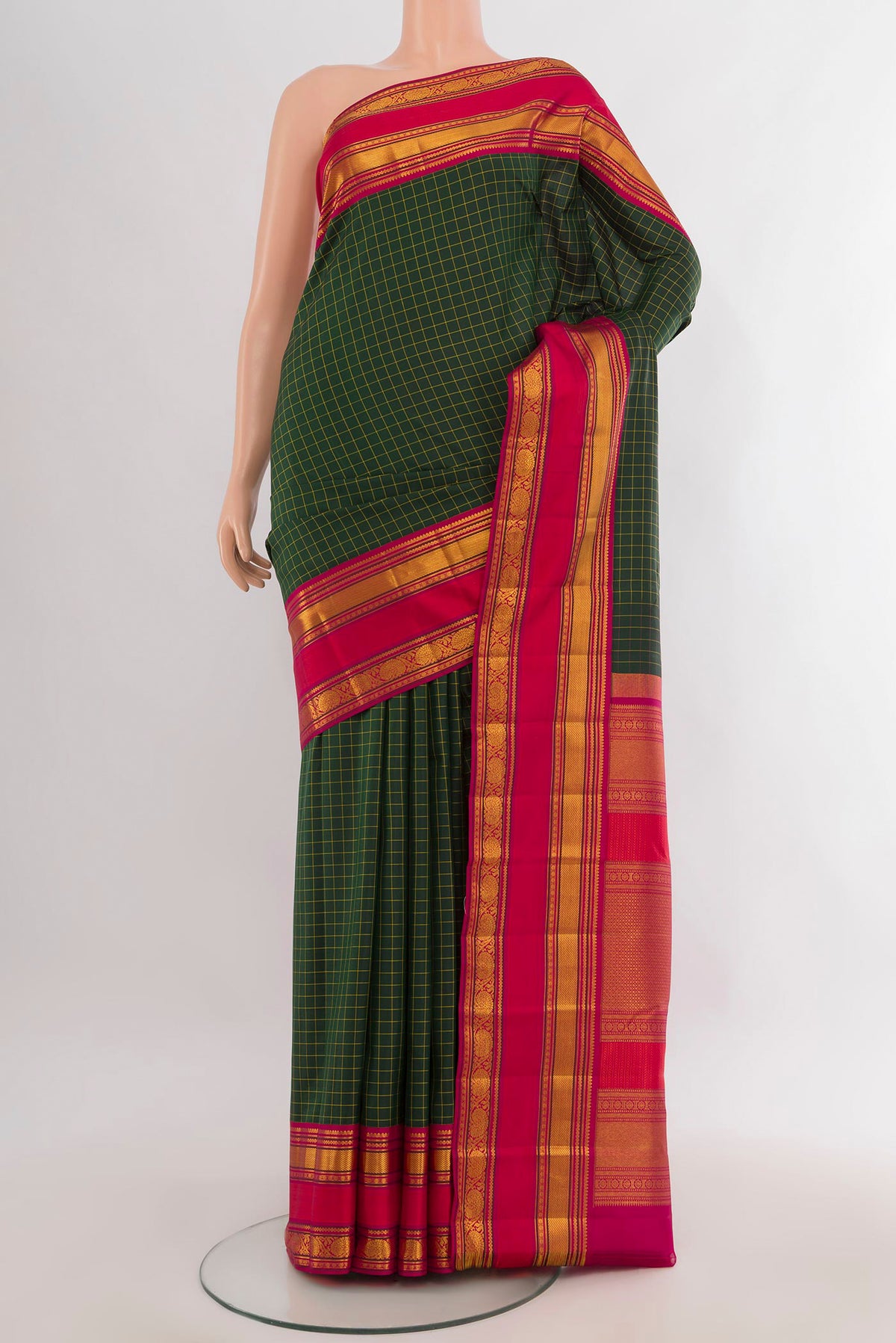 Pure Silk Bottle Green Kanchipuram Saree with Checked design on the body and Zari Border.  displayed on a mannequin