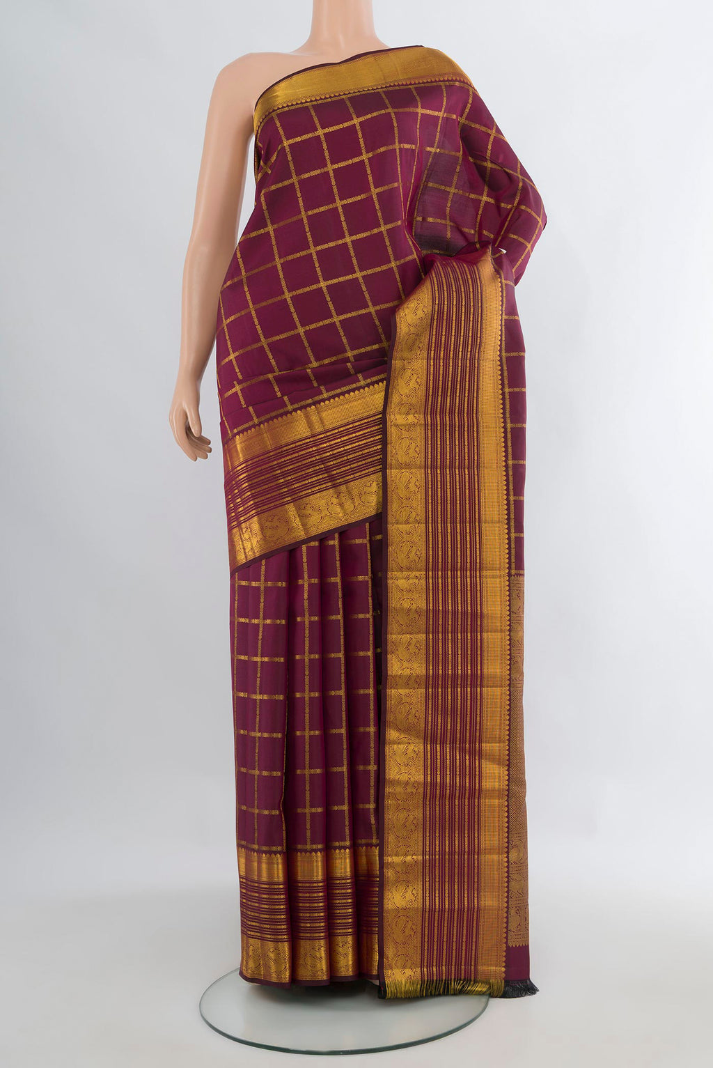 Pure Silk Coffee Brown Kanchipuram Saree with Checked design on the body and Zari Border.  displayed on a mannequin