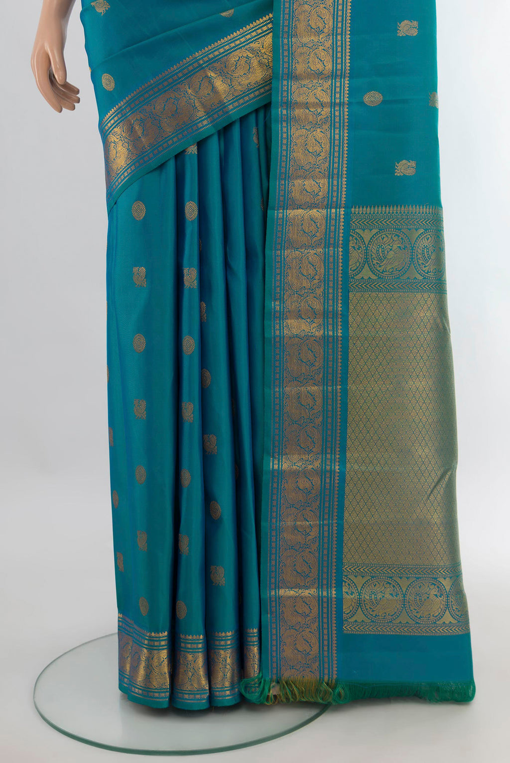 Pleats and pallu of Pure Silk Peacock Blue Kanchipuram Saree with Zari Butta on the body and Zari Border. 
