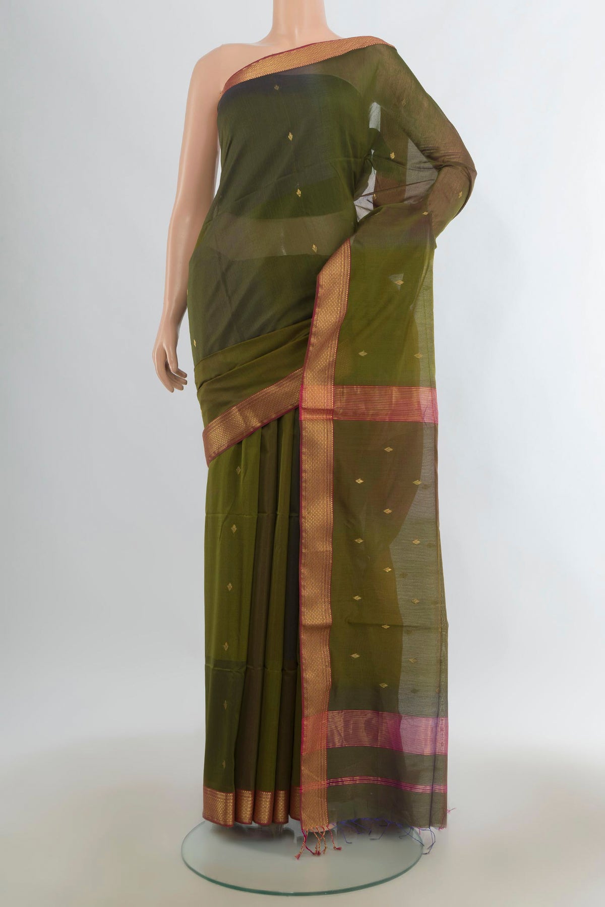 Mehandi Green Maheshwari Cotton Saree with Zari Butta on the body and Zari Border.  displayed on a mannequin