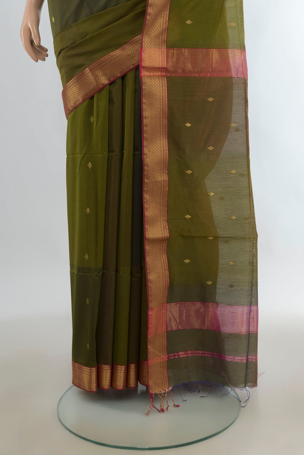 Pleats and pallu of Mehandi Green Maheshwari Cotton Saree with Zari Butta on the body and Zari Border. 