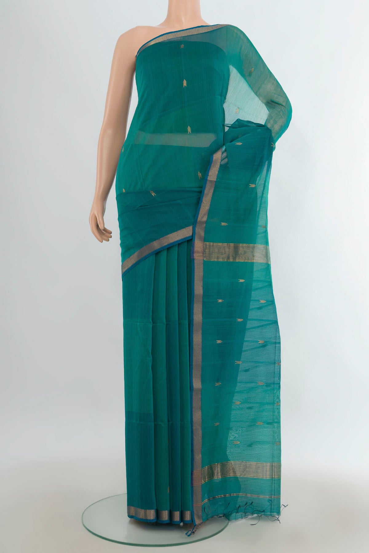 Turquoise Maheshwari Cotton Saree with Zari Butta on the body and Zari Border.  displayed on a mannequin
