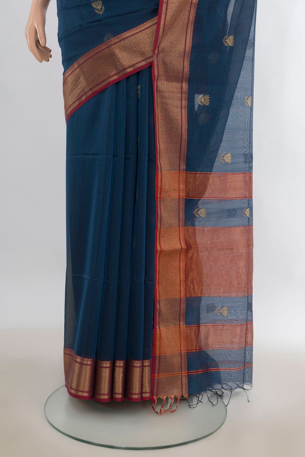 Pleats and pallu of Peacock Blue Maheshwari Cotton Saree with Zari Butta on the body and Zari Border. 