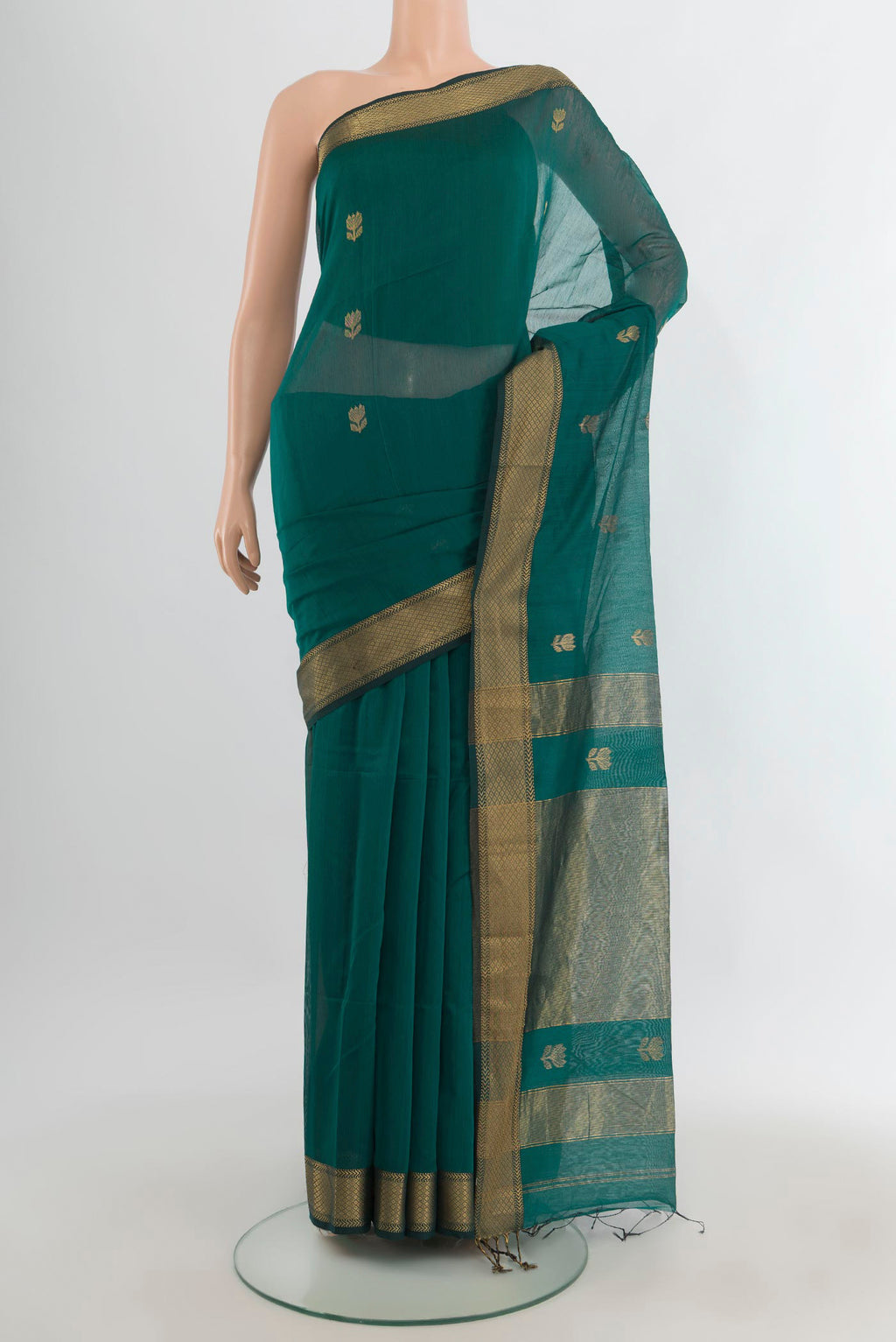 Green Maheshwari Cotton Saree with Zari Butta on the body and Zari Border.  displayed on a mannequin