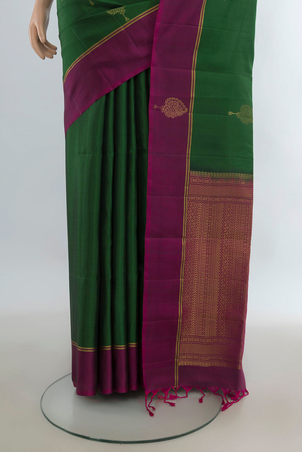 Pleats and pallu of Pure Silk Green Soft Saree with Zari Butta on the body and Fancy Border. 