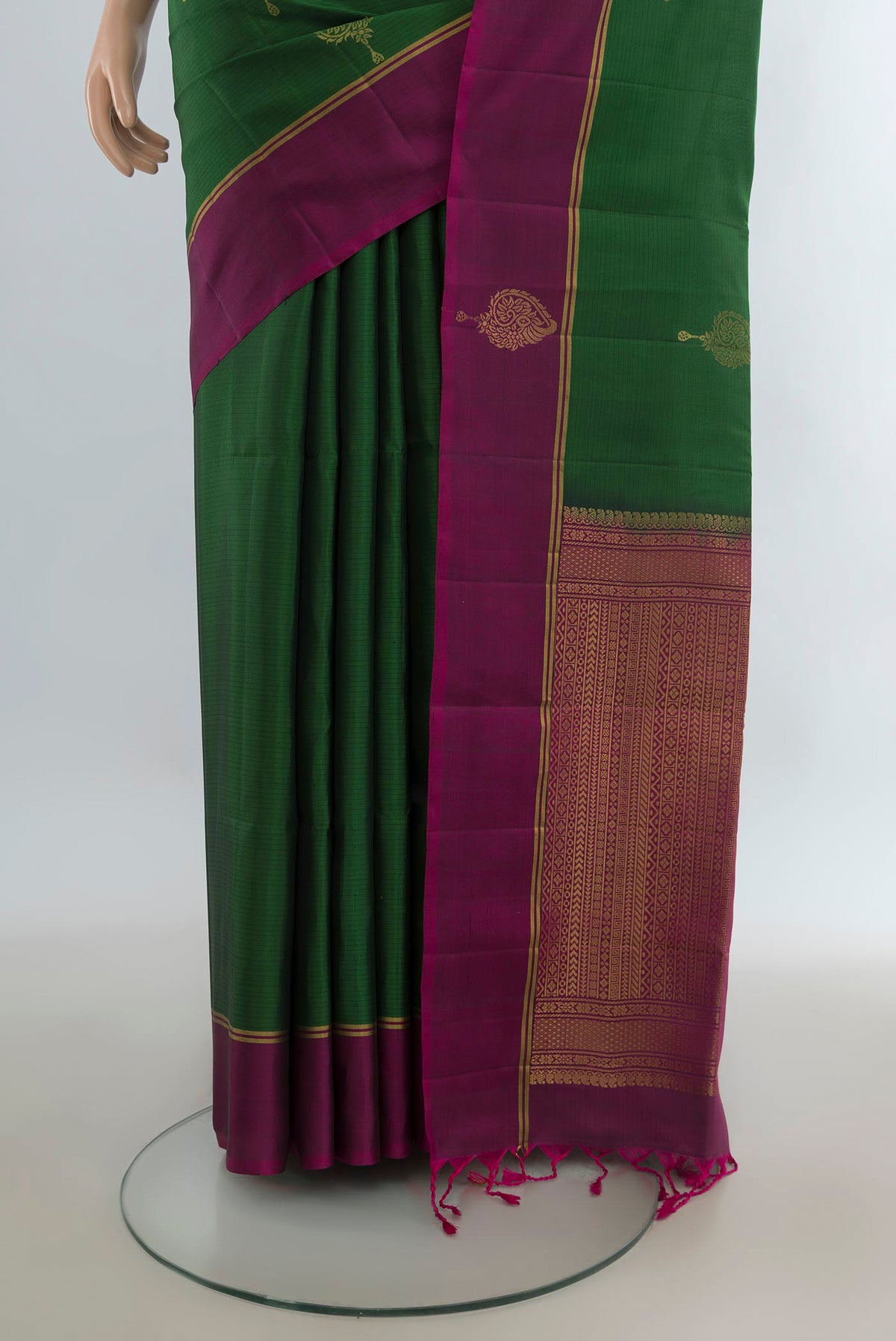 Pleats and pallu of Pure Silk Green Soft Saree with Zari Butta on the body and Fancy Border. 