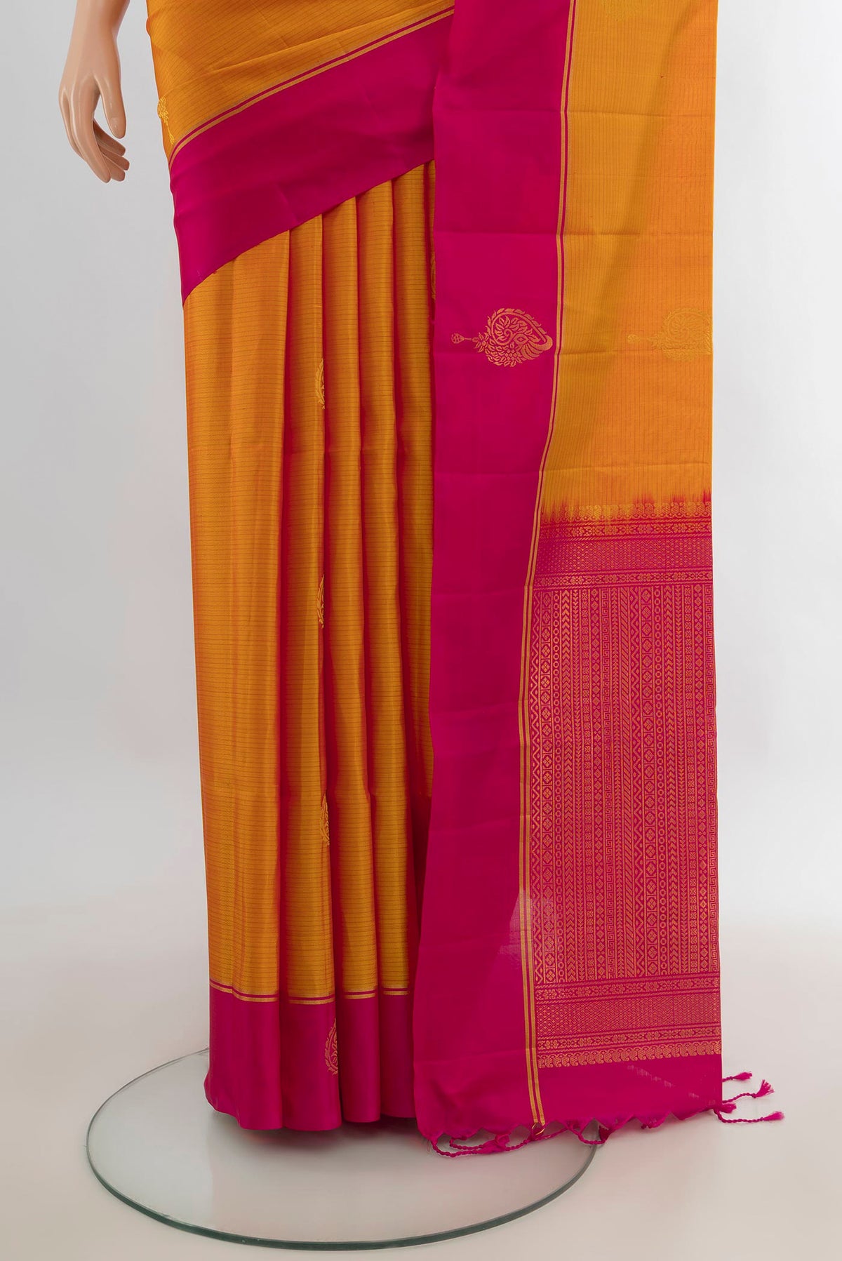 Pleats and pallu of Pure Silk Mustard Soft Saree with Zari Butta on the body and Plain Border. 