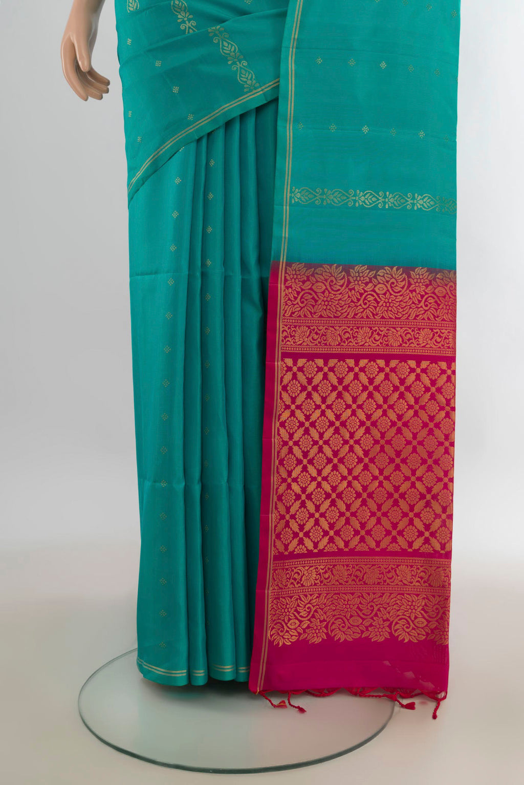 Pleats and pallu of Pure Silk Turquoise Soft Saree with Zari Butta on the body and Zari Border. 