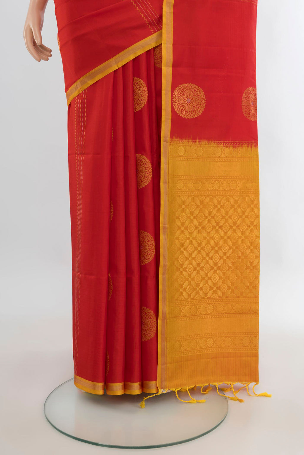 Pleats and pallu of Pure Silk Red Soft Saree with Zari Butta on the body and Plain Border. 