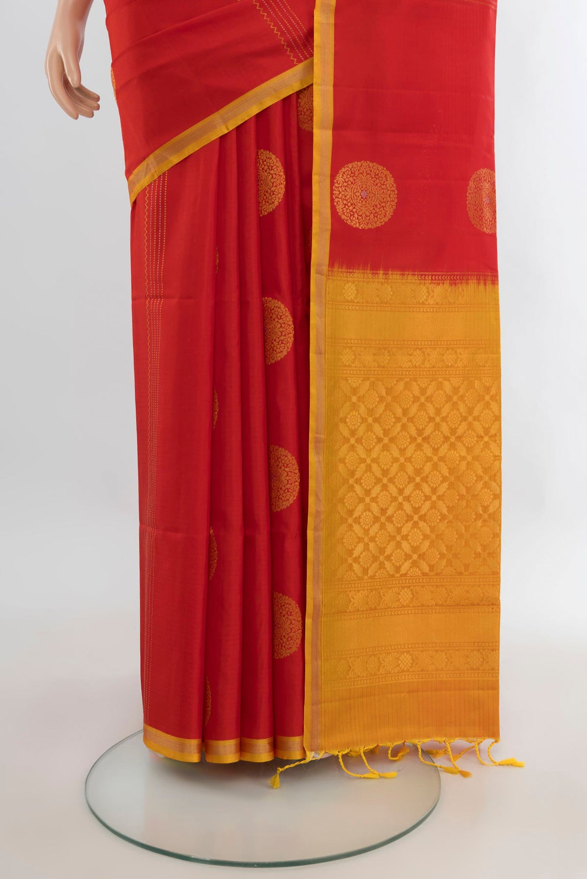 Pleats and pallu of Pure Silk Red Soft Saree with Zari Butta on the body and Plain Border. 