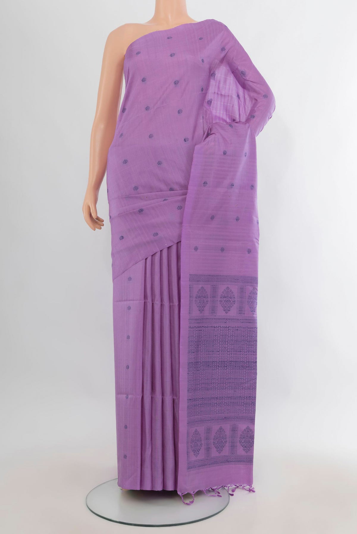 Pure Silk Lavender Soft Saree with Thread Butta on the body and Without Border.  displayed on a mannequin