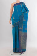 Pure Silk Peacock Blue Soft Saree with Zari Butta on the body and Plain Border.  displayed on a mannequin