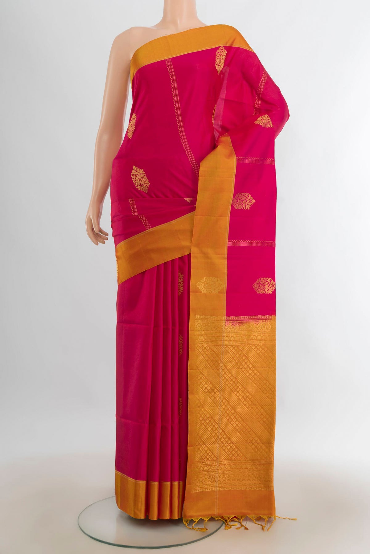 Pure Silk Dark Pink Soft Saree with Zari Butta on the body and Silk Border.  displayed on a mannequin