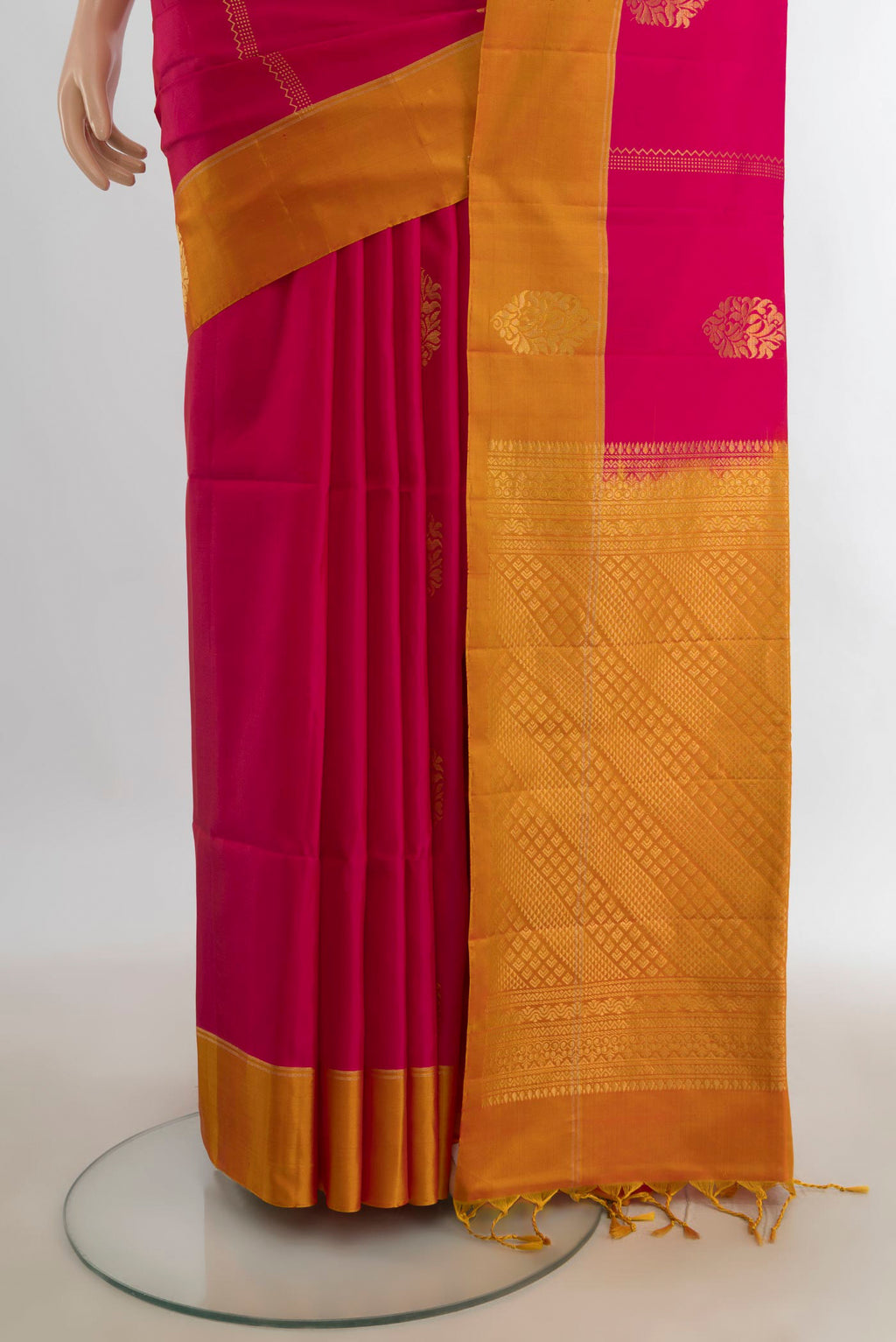 Pleats and pallu of Pure Silk Dark Pink Soft Saree with Zari Butta on the body and Silk Border. 