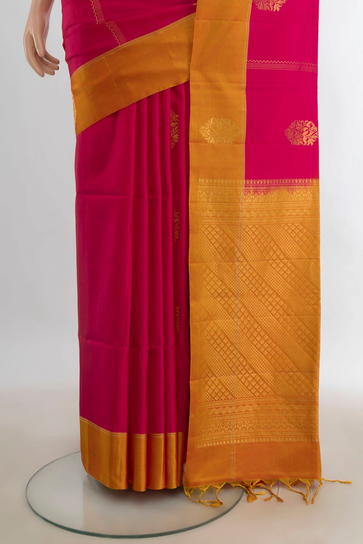 Pleats and pallu of Pure Silk Dark Pink Soft Saree with Zari Butta on the body and Silk Border. 