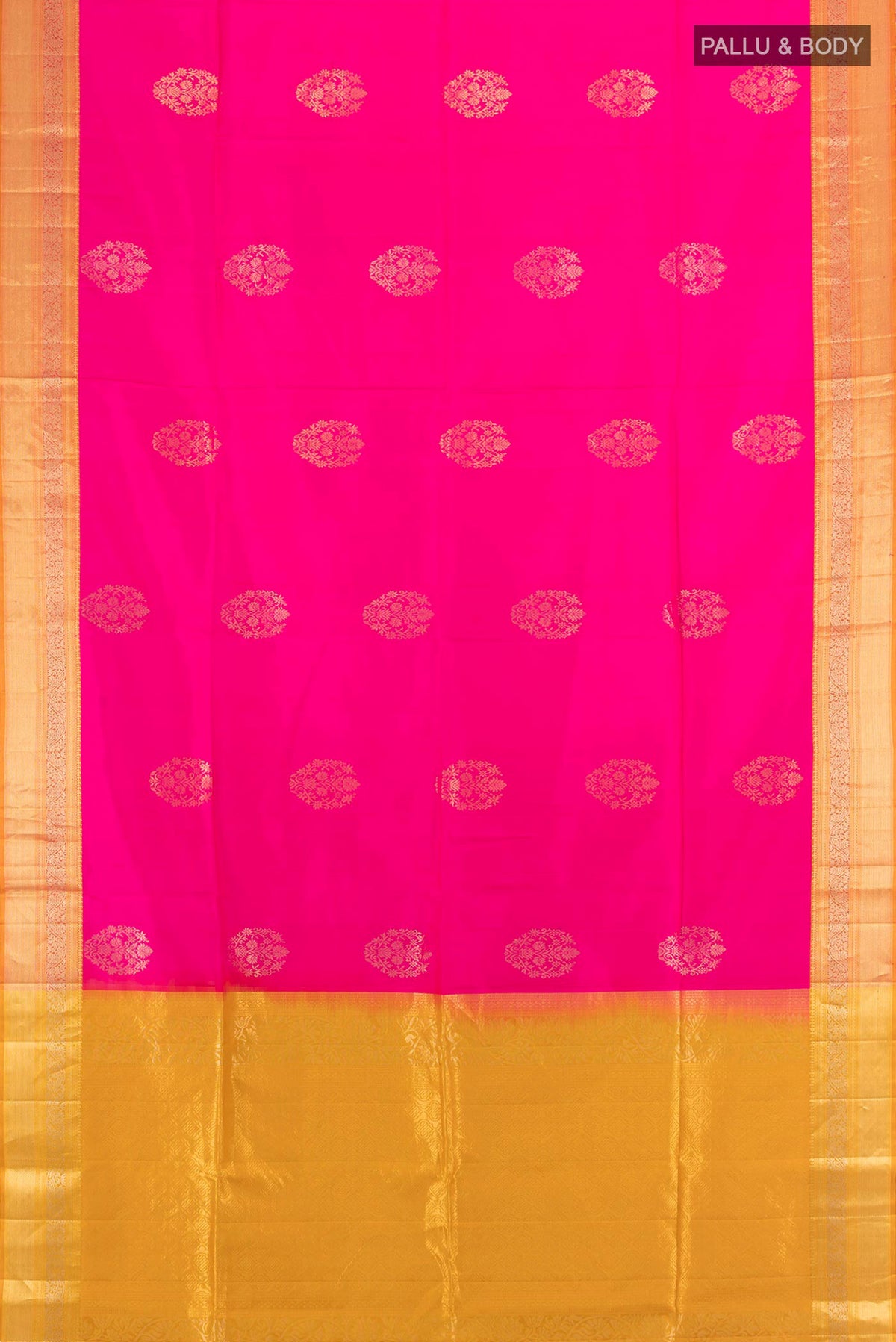 Flat view of Pure Silk Rani Pink Soft Saree with Zari Butta on the body and Zari Border. 