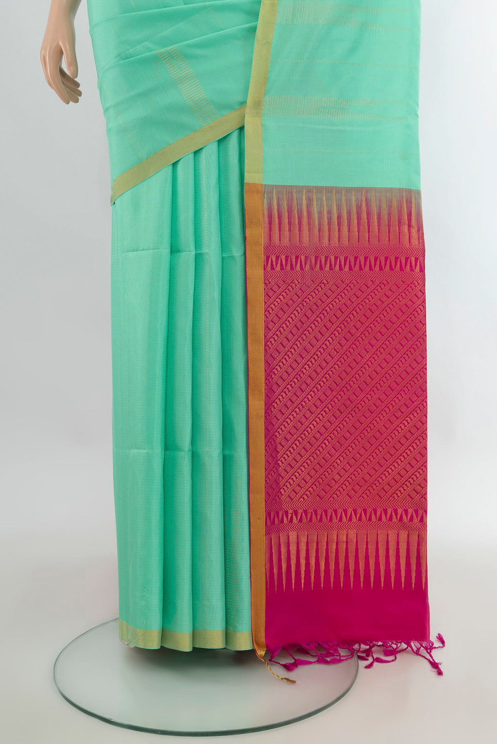 Pleats and pallu of Pure Silk Mint Green Soft Saree with Zari Butta on the body and Zari Border. 