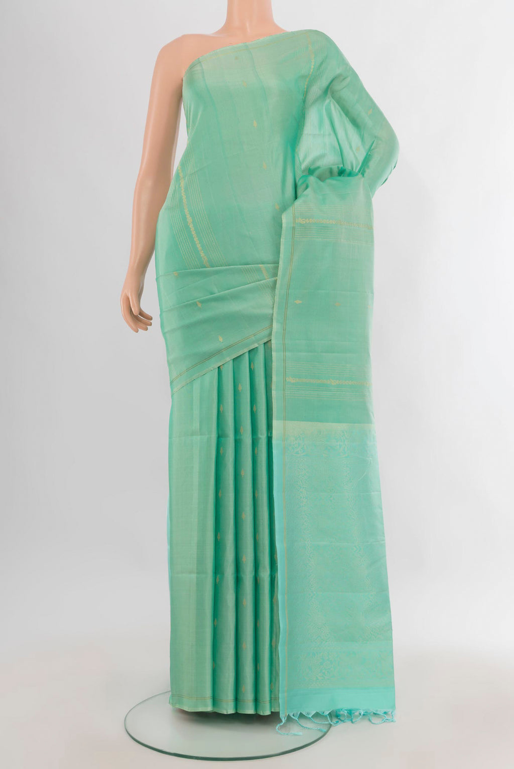 Pure Silk Light Green Soft Saree with Zari Butta on the body and Without Border.  displayed on a mannequin