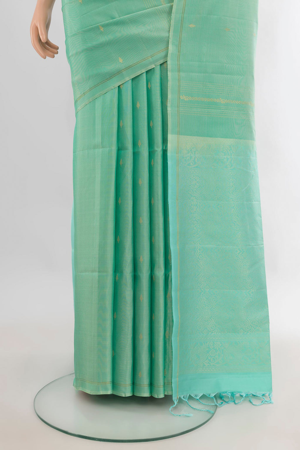 Pleats and pallu of Pure Silk Light Green Soft Saree with Zari Butta on the body and Without Border. 