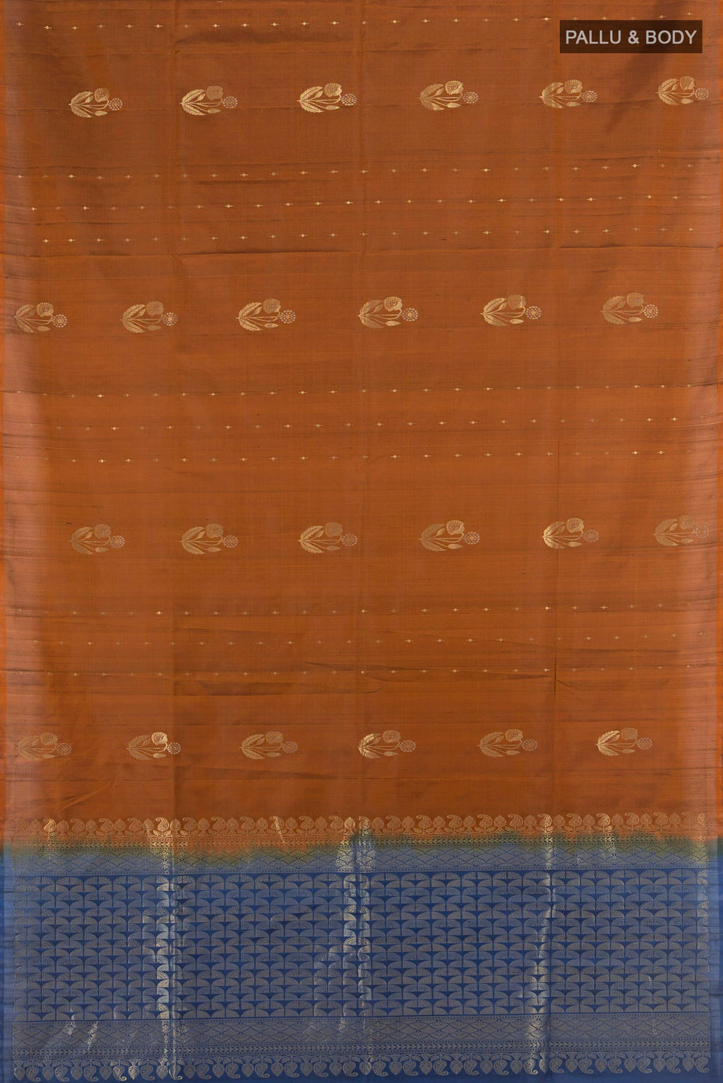 Flat view of Pure Silk Rust Soft Saree with Zari Butta on the body and Without Border. 
