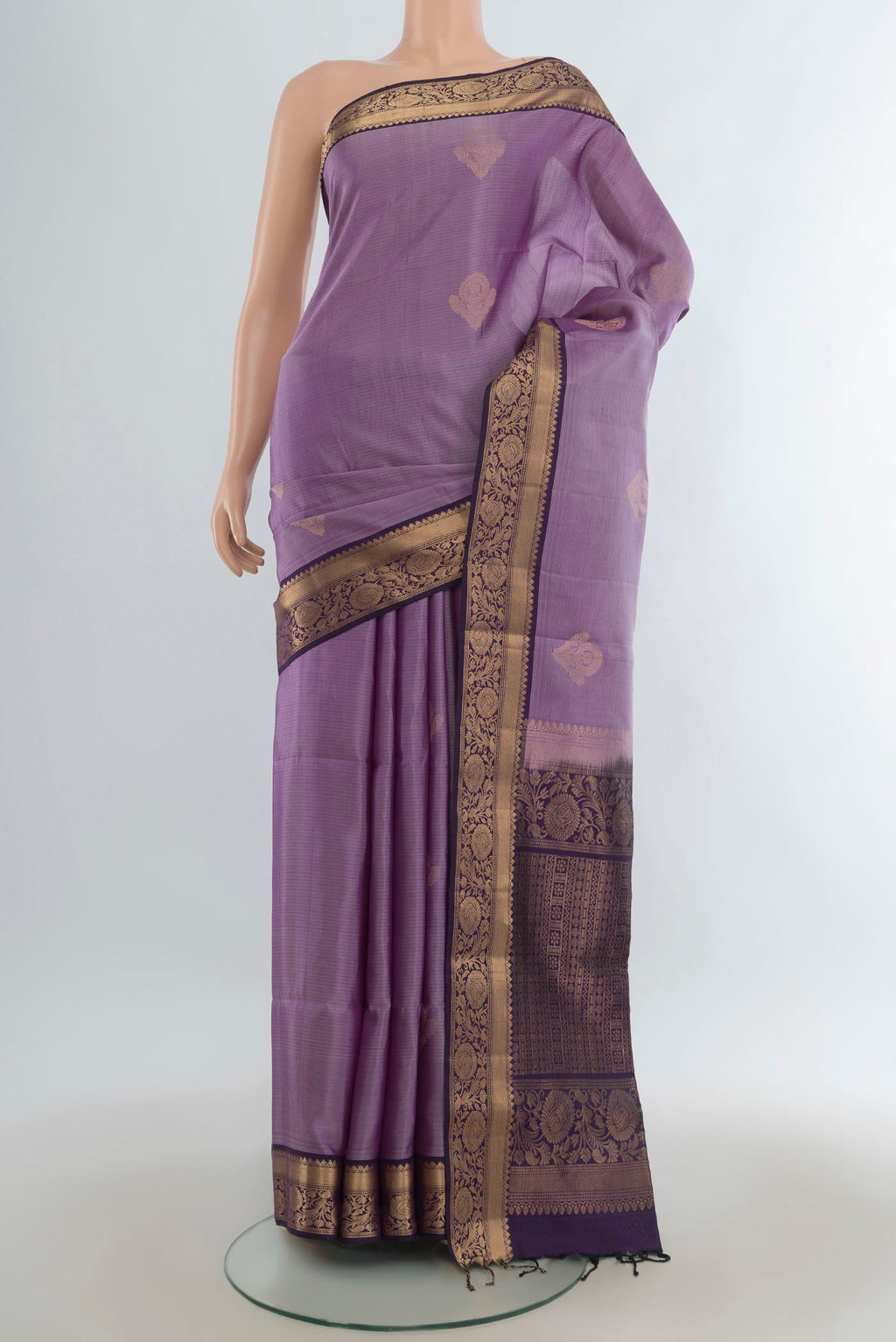 Pure Silk Lavender Soft Saree with Zari Butta on the body and Zari Border.  displayed on a mannequin