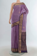 Pure Silk Lavender Soft Saree with Zari Butta on the body and Zari Border.  displayed on a mannequin