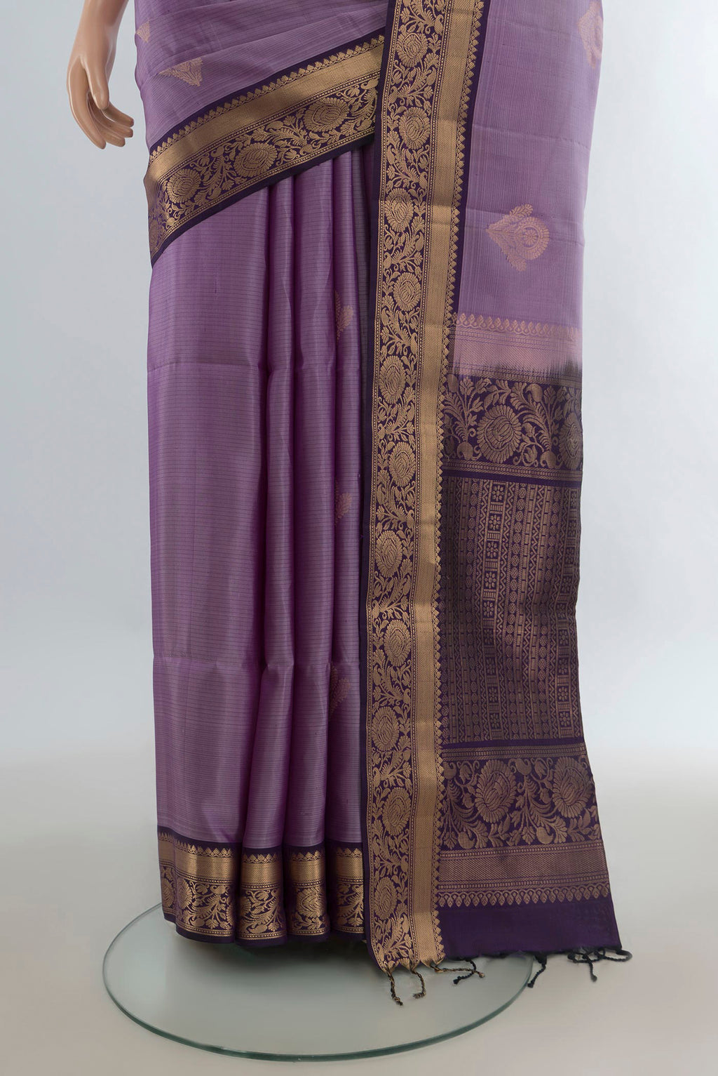 Pleats and pallu of Pure Silk Lavender Soft Saree with Zari Butta on the body and Zari Border. 