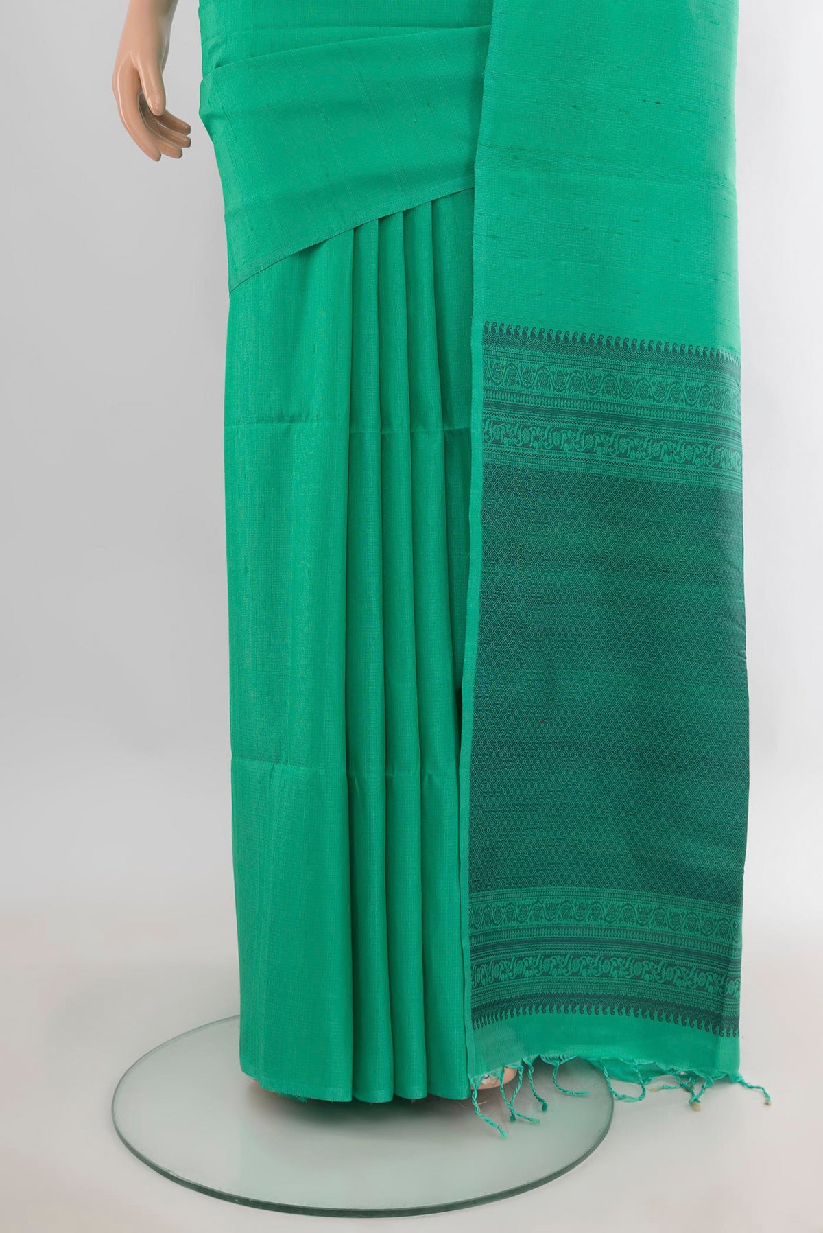 Pleats and pallu of Pure Silk Green Soft Saree with Plain Body and Without Border. 