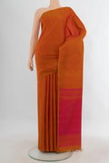 Pure Silk Rust Soft Saree with Plain Body and Without Border.  displayed on a mannequin