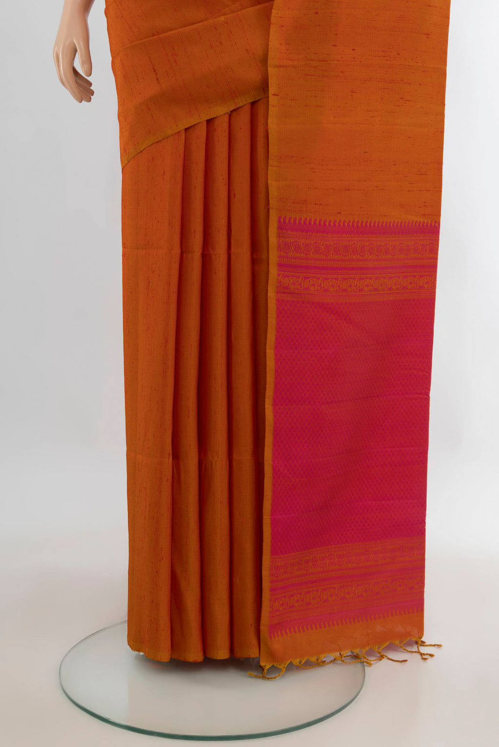 Pleats and pallu of Pure Silk Rust Soft Saree with Plain Body and Without Border. 