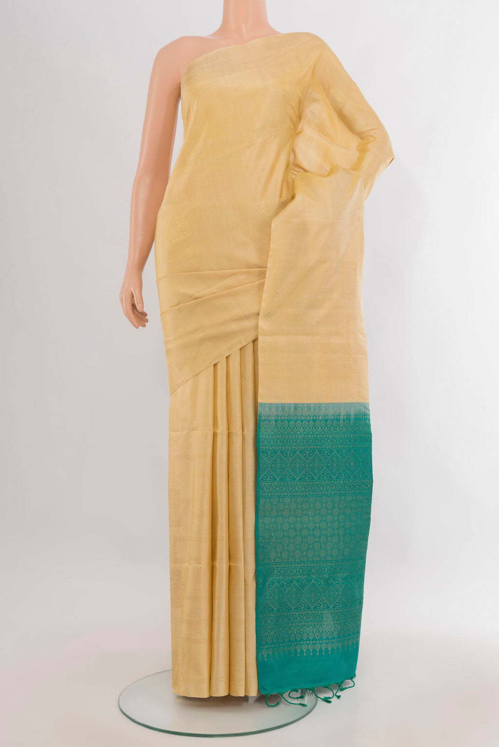 Pure Silk Sandal Soft Saree with Zari Butta on the body and Without Border.  displayed on a mannequin