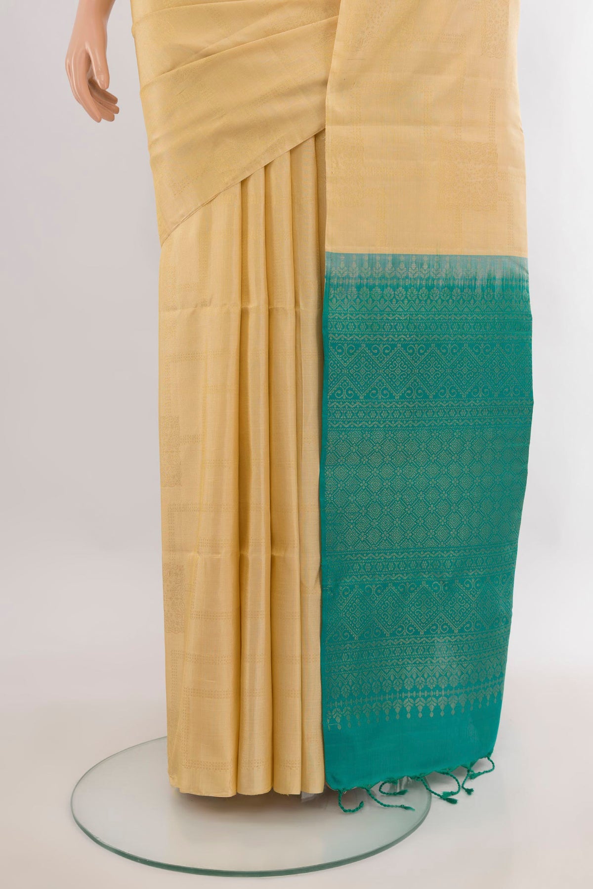 Pleats and pallu of Pure Silk Sandal Soft Saree with Zari Butta on the body and Without Border. 