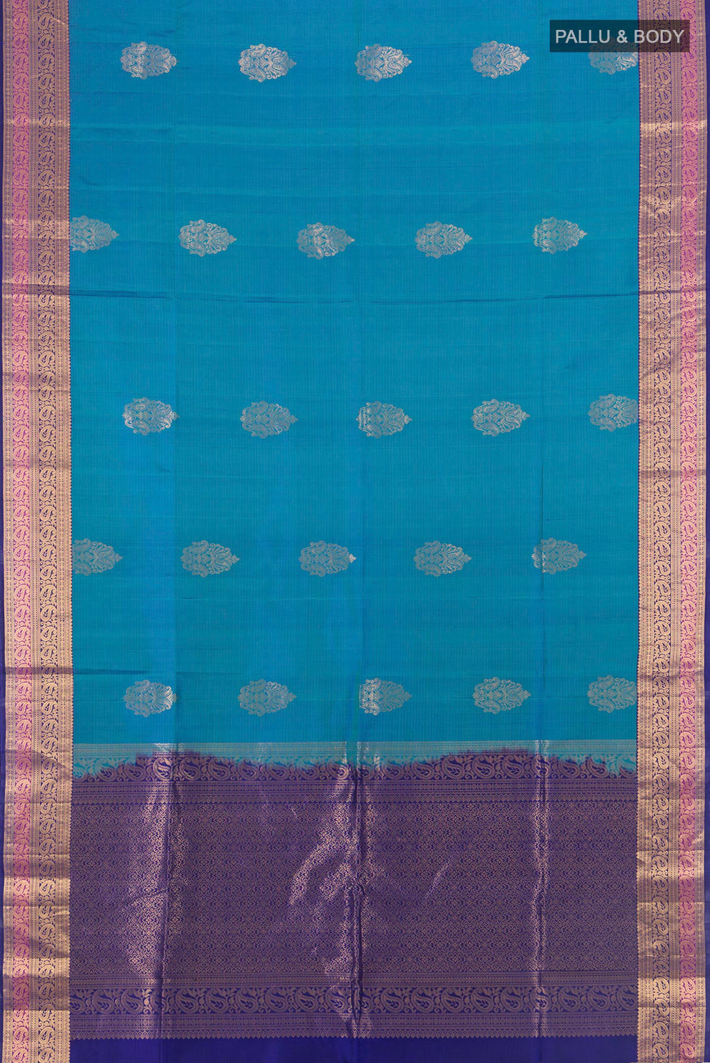 Flat view of Pure Silk Peacock Blue Soft Saree with Zari Butta on the body and Zari Border. 