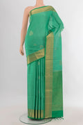 Pure Silk Light Green Soft Saree with Zari Butta on the body and Zari Border.  displayed on a mannequin