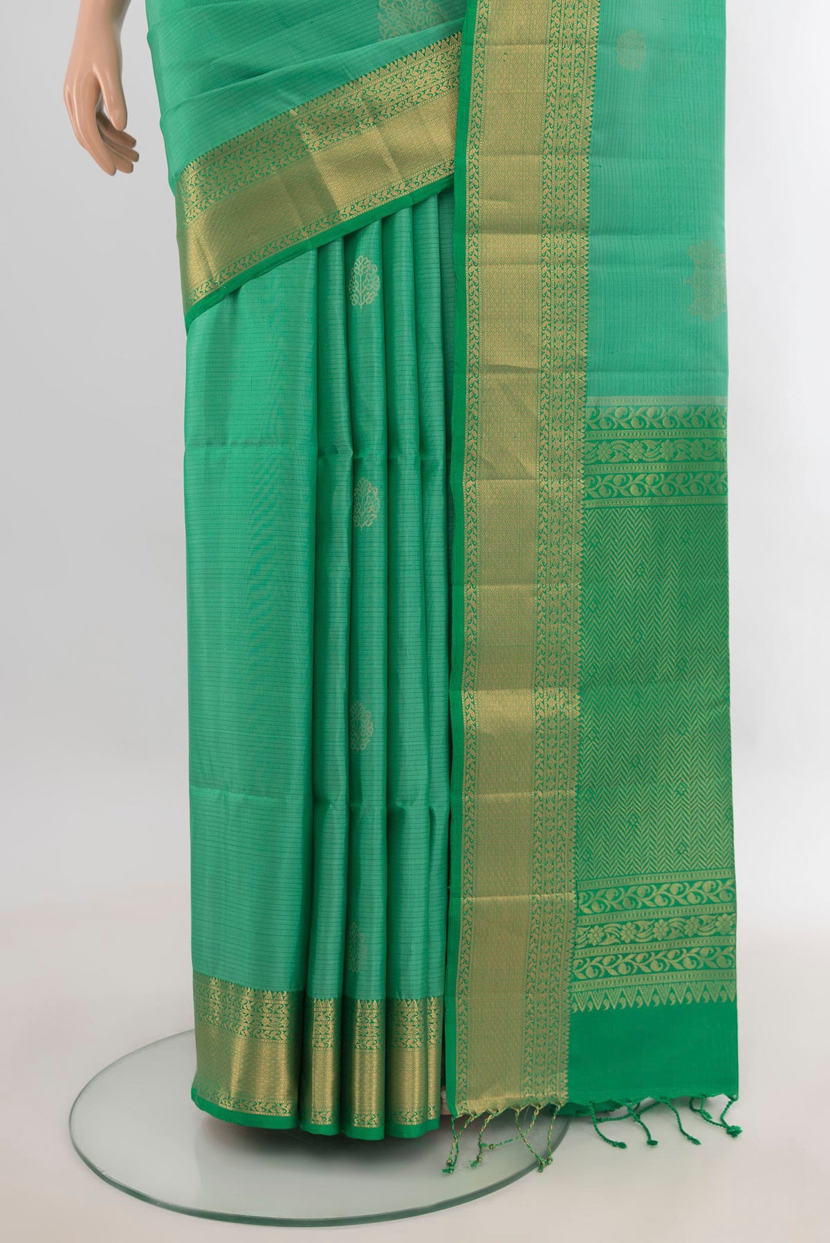 Pleats and pallu of Pure Silk Light Green Soft Saree with Zari Butta on the body and Zari Border. 