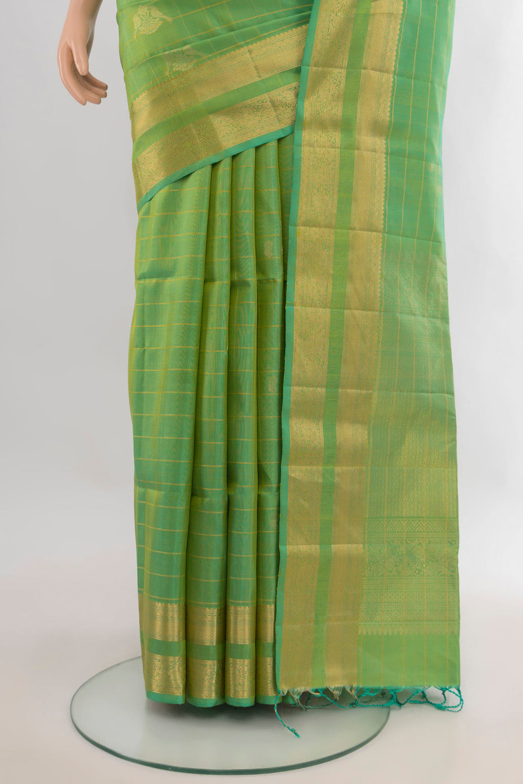 Pleats and pallu of Pure Silk Light Green Soft Saree with Checked design on the body and Zari Border. 