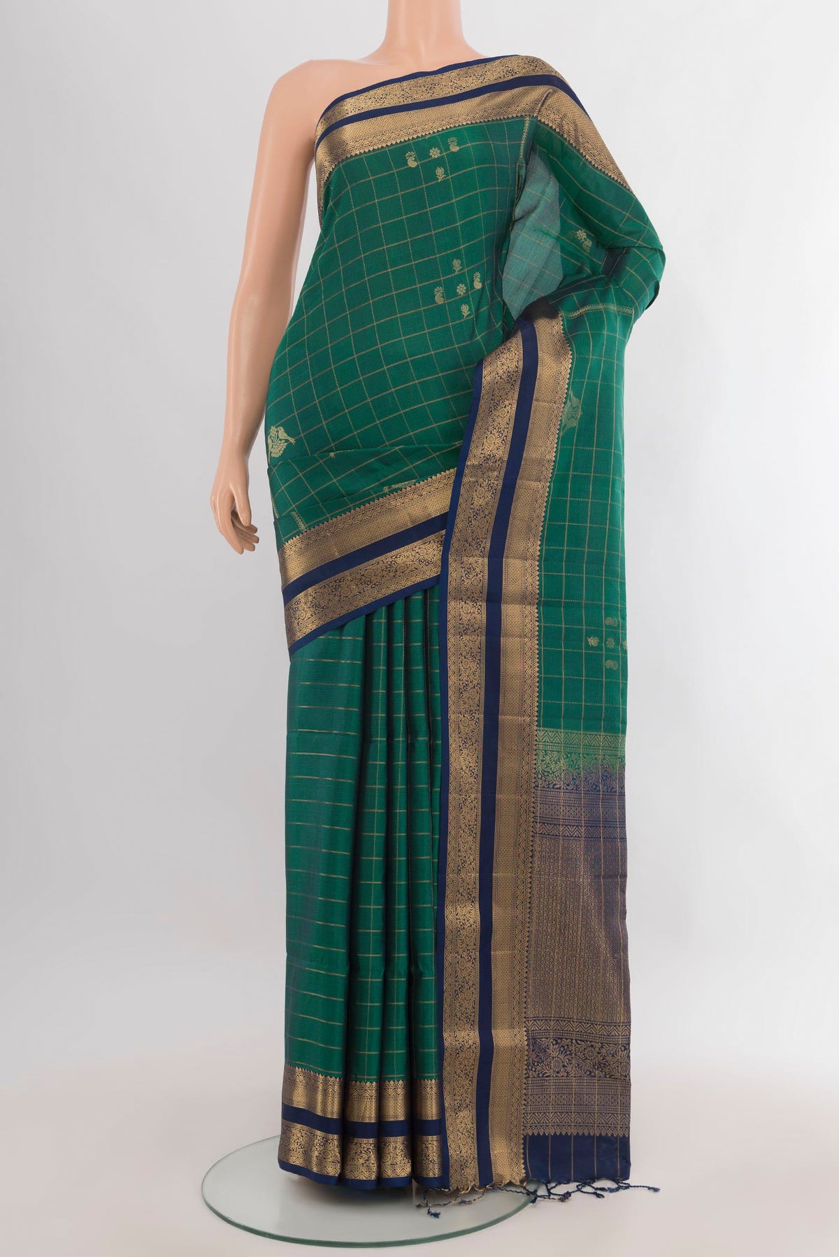 Pure Silk Green Soft Saree with Checked design on the body and Zari Border.  displayed on a mannequin