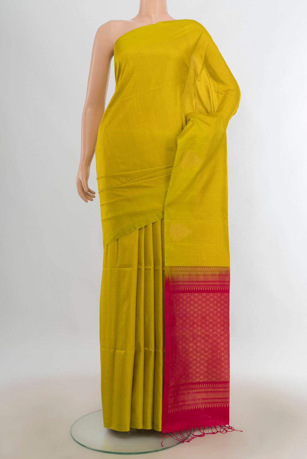 Pure Silk Light Green Soft Saree with Zari Butta on the body and Silk Border.  displayed on a mannequin