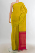Pure Silk Light Green Soft Saree with Zari Butta on the body and Silk Border.  displayed on a mannequin