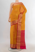 Pure Silk Mustard Soft Saree with Zari Butta on the body and Zari Border.  displayed on a mannequin