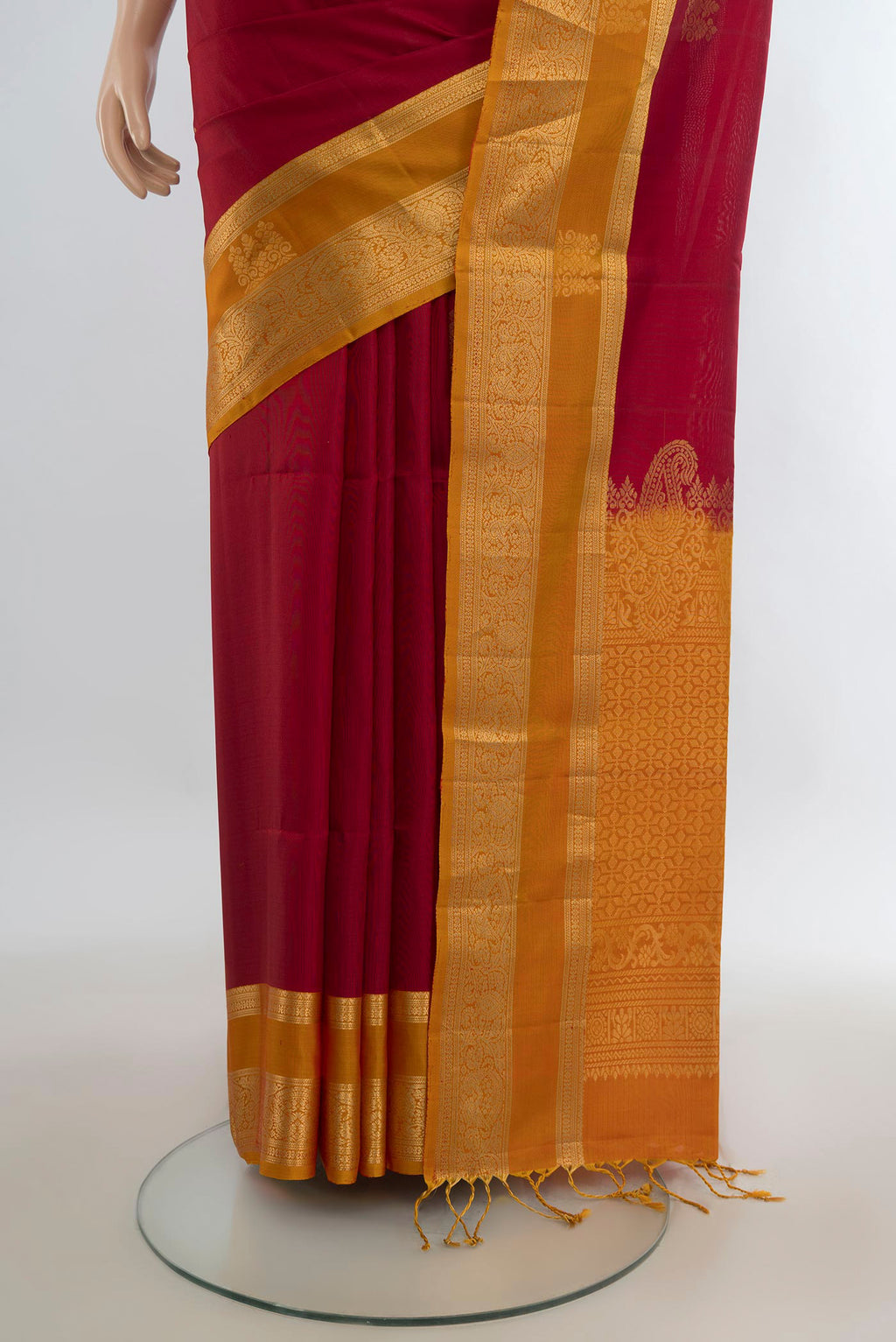 Pleats and pallu of Pure Silk Red Soft Saree with Zari Butta on the body and Zari Border. 