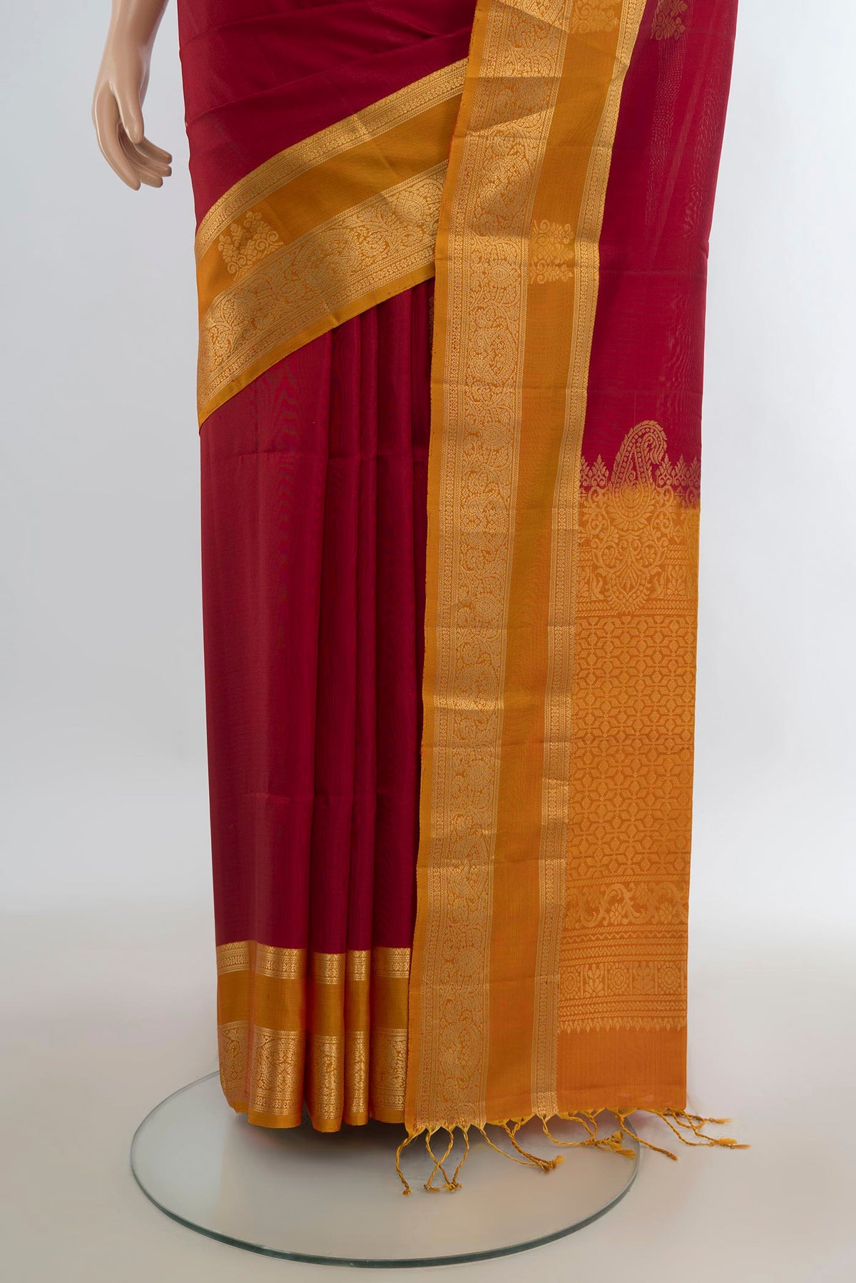 Pleats and pallu of Pure Silk Red Soft Saree with Zari Butta on the body and Zari Border. 