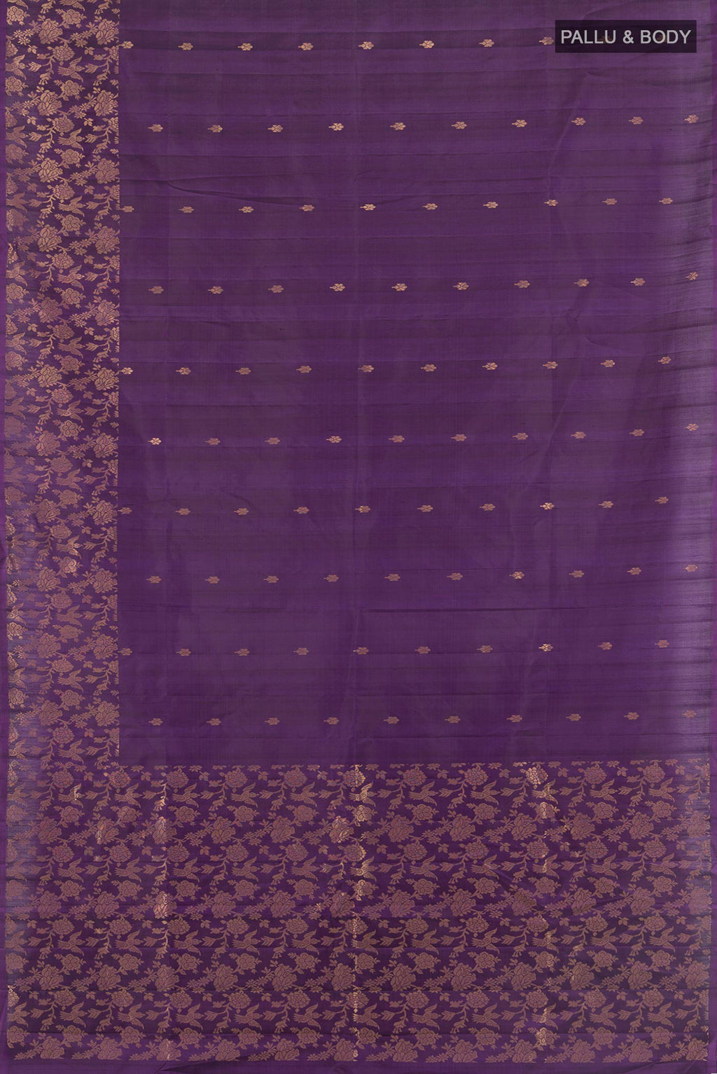 Flat view of Pure Silk Violet Soft Saree with Zari Butta on the body and Fancy Border. 