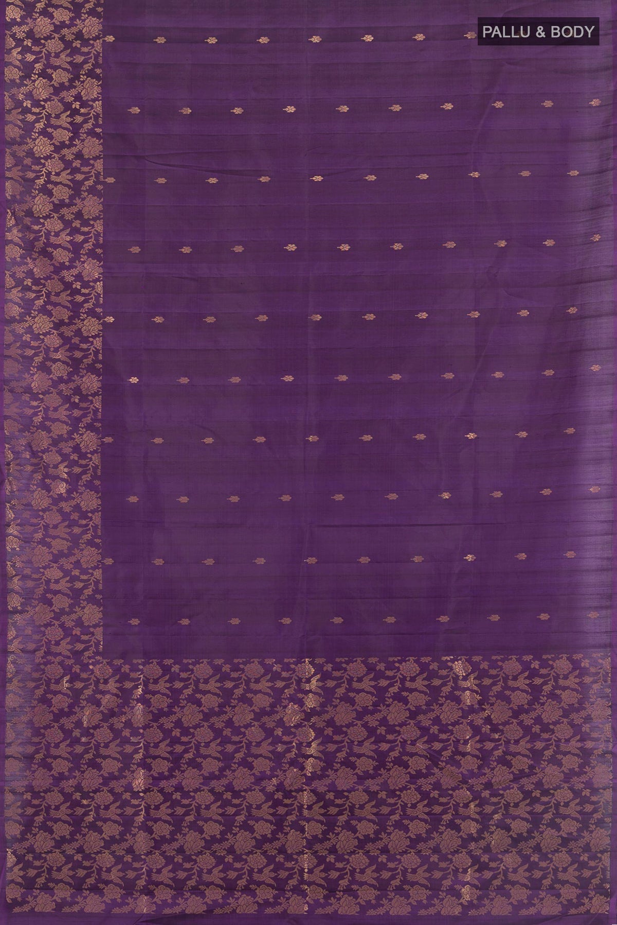 Flat view of Pure Silk Violet Soft Saree with Zari Butta on the body and Fancy Border. 