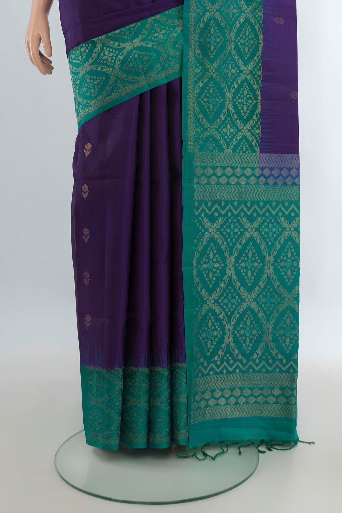 Pleats and pallu of Pure Silk Violet Soft Saree with Zari Butta on the body and Zari Border. 